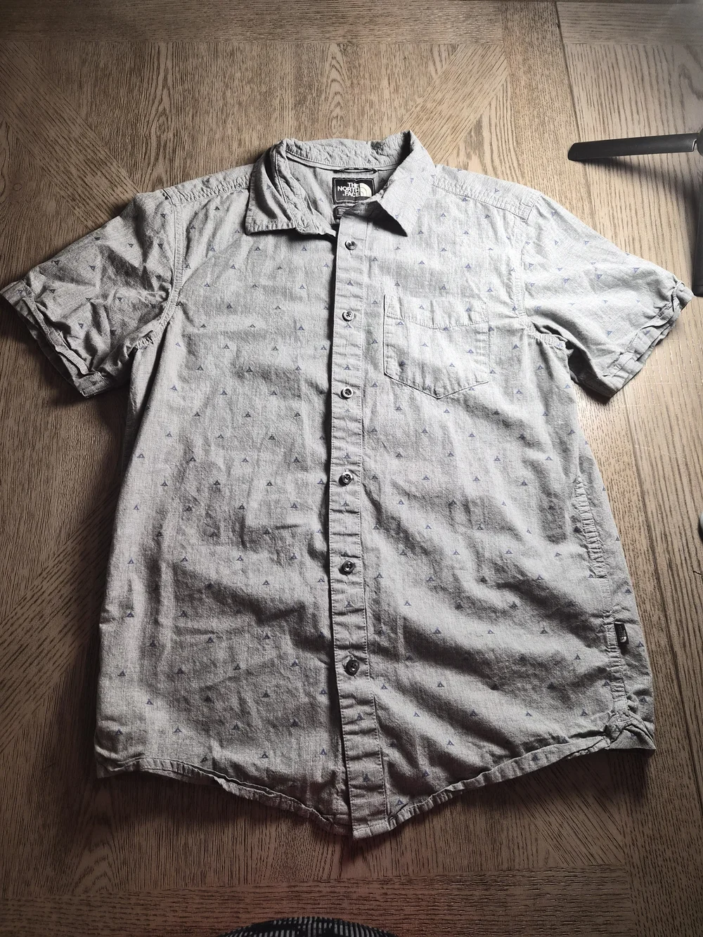 The North Face Light Gray Short Sleeve Button-Down Shirt with Subtle Print